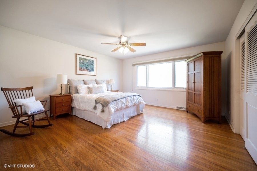 848 Timber Hill Road Highland Park, IL 60035 - Photo 11 of 21 a bedroom with a bed wooden floor and window