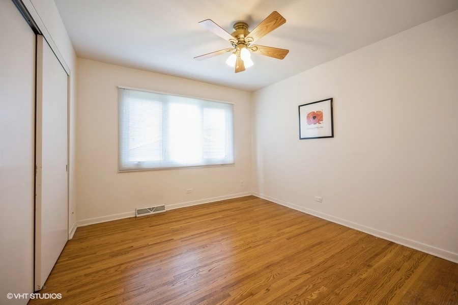 848 Timber Hill Road Highland Park, IL 60035 - Photo 15 of 21 a view of empty room with wooden floor and fan