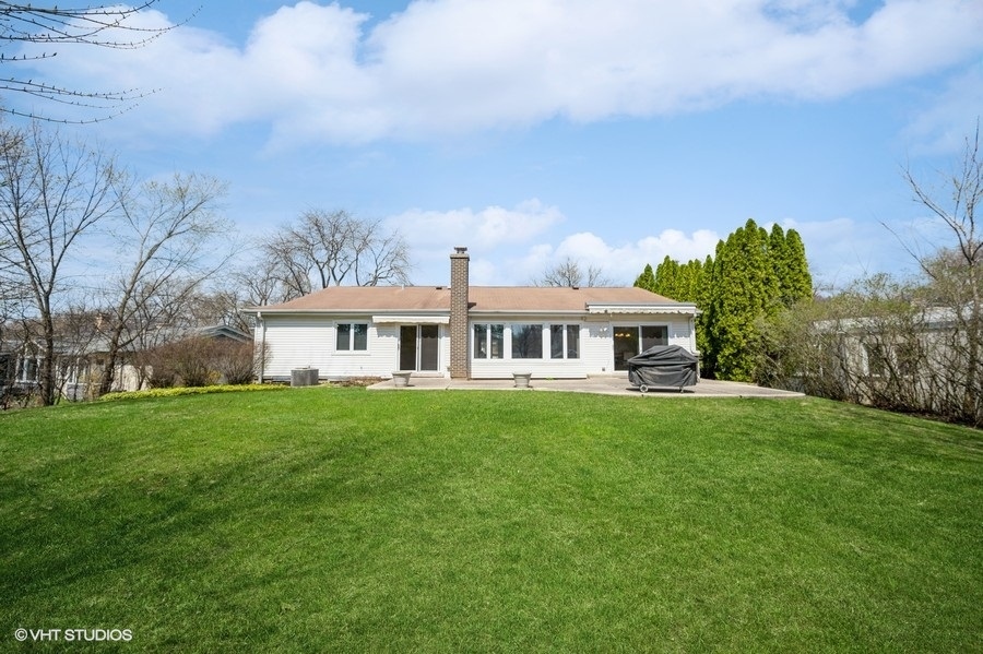 848 Timber Hill Road Highland Park, IL 60035 - Photo 17 of 21 a front view of a house with garden
