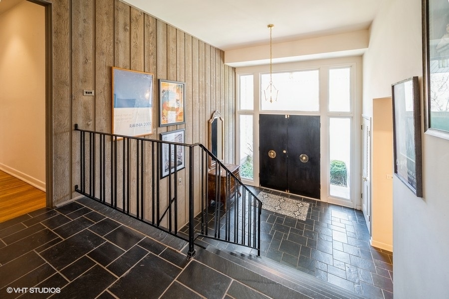 848 Timber Hill Road Highland Park, IL 60035 - Photo 2 of 21 a view of a hallway with wooden floor and windows