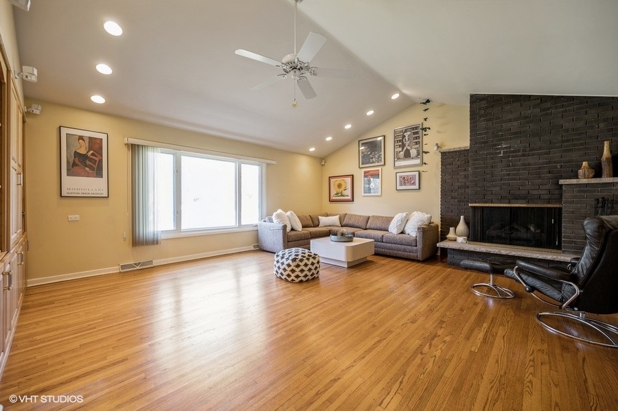 848 Timber Hill Road Highland Park, IL 60035 - Photo 4 of 21 a living room with furniture and a fireplace