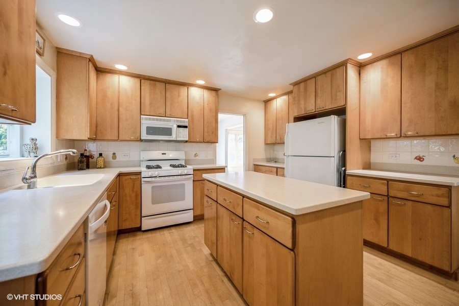 848 Timber Hill Road Highland Park, IL 60035 - Photo 6 of 21 a kitchen with a sink a stove a refrigerator and cabinets