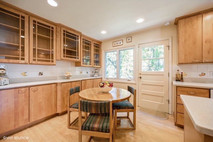848 Timber Hill Road Highland Park, IL 60035 - Photo 7 of 21 a kitchen with a dining table chairs and window