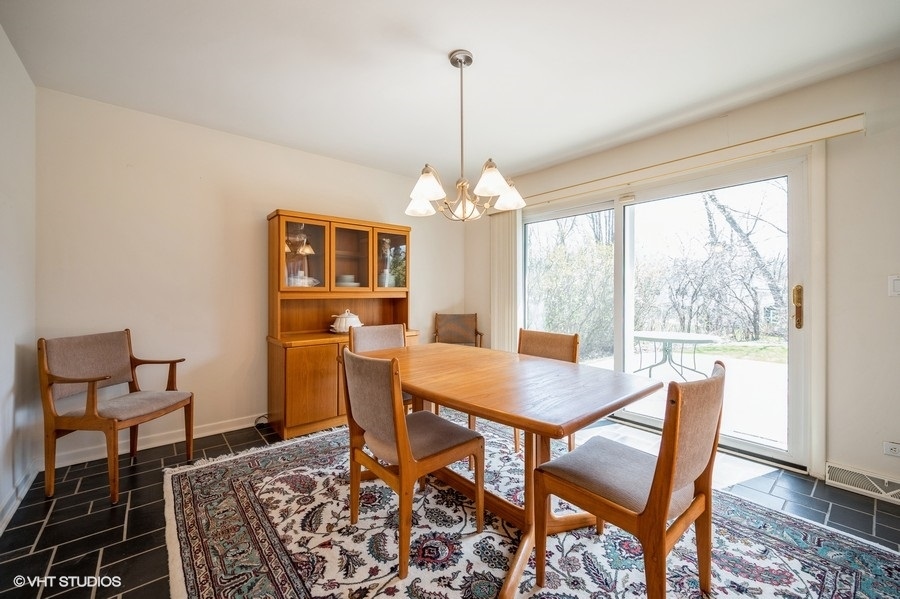 848 Timber Hill Road Highland Park, IL 60035 - Photo 10 of 21 a view of a dining room with furniture window and outside view