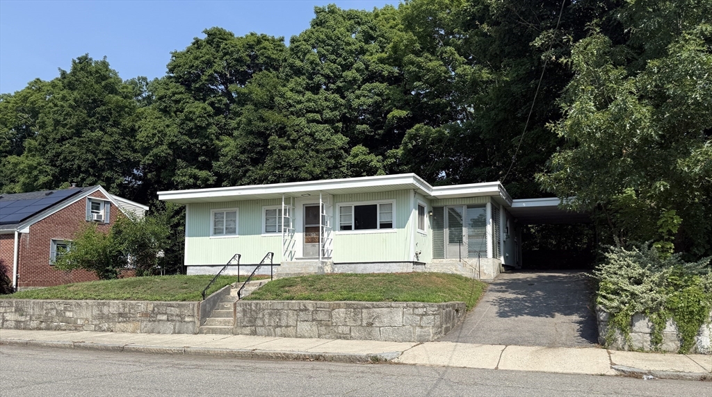 36 5th Avenue Lowell, MA 01854 - Photo 1 of 16 front view of a house with a yard