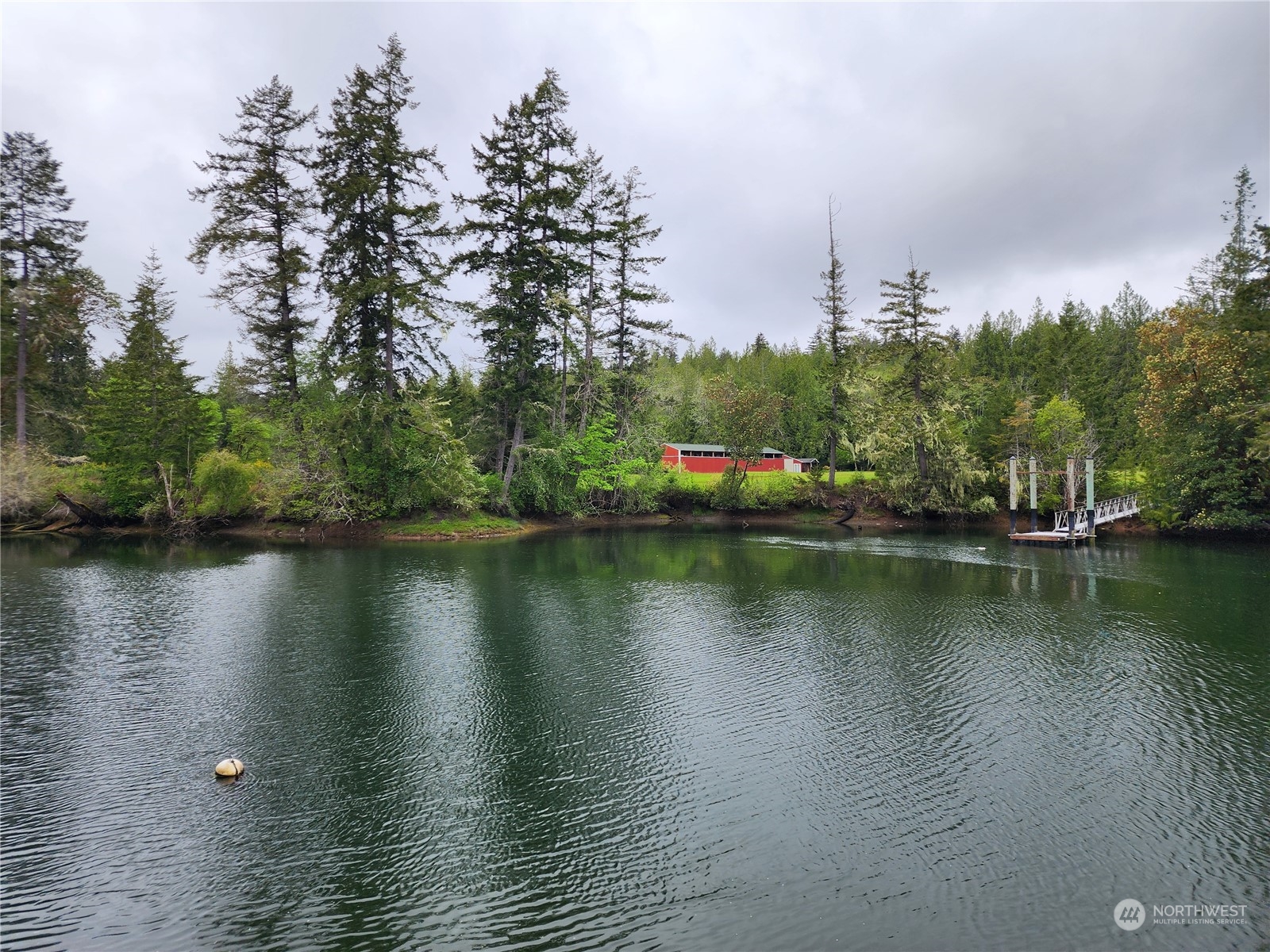 161 East Geist Point Road Shelton, WA 98584 - Photo 2 of 14 a view of a lake with houses