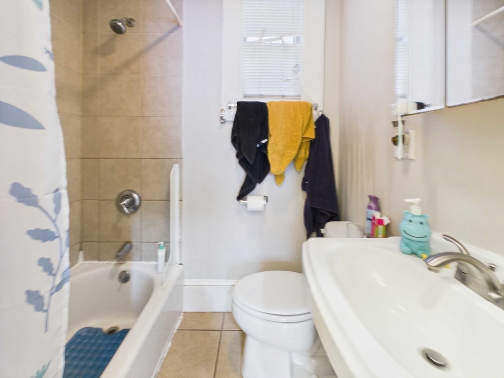 16-22 Reedsdale Street Boston, MA 02134 - Photo 11 of 39 a bathroom with a sink and toilet