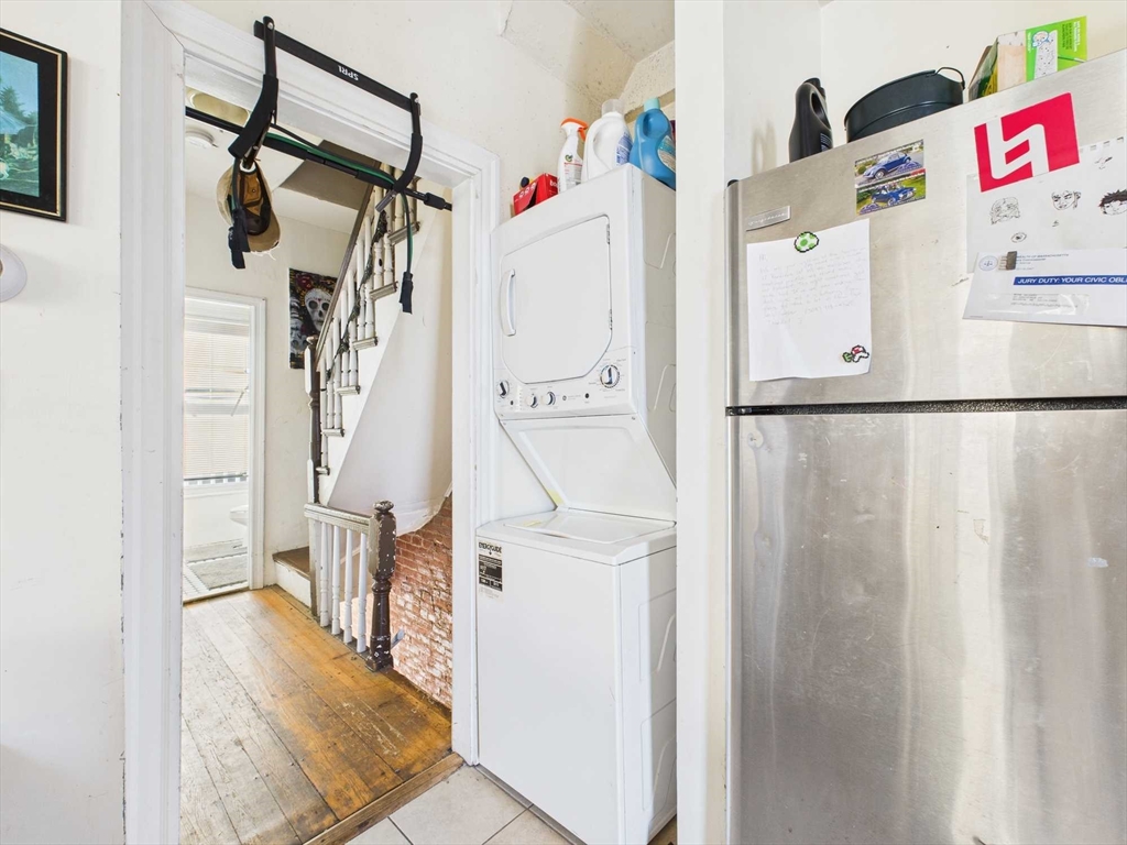 16-22 Reedsdale Street Boston, MA 02134 - Photo 19 of 39 a utility room with a refrigerator a washer and dryer