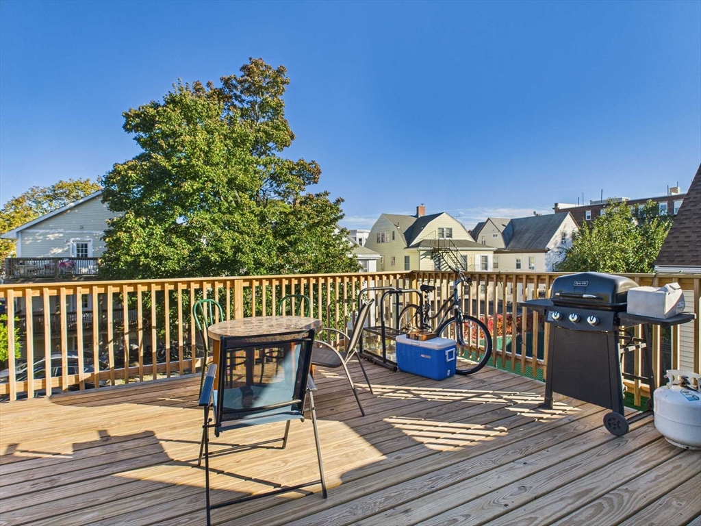 16-22 Reedsdale Street Boston, MA 02134 - Photo 21 of 39 a view of a chairs and table on the deck