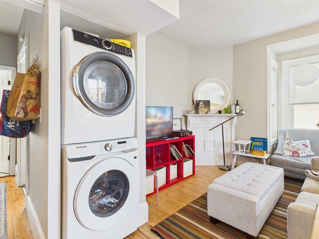 16-22 Reedsdale Street Boston, MA 02134 - Photo 24 of 39 a living room with furniture and a wooden floor