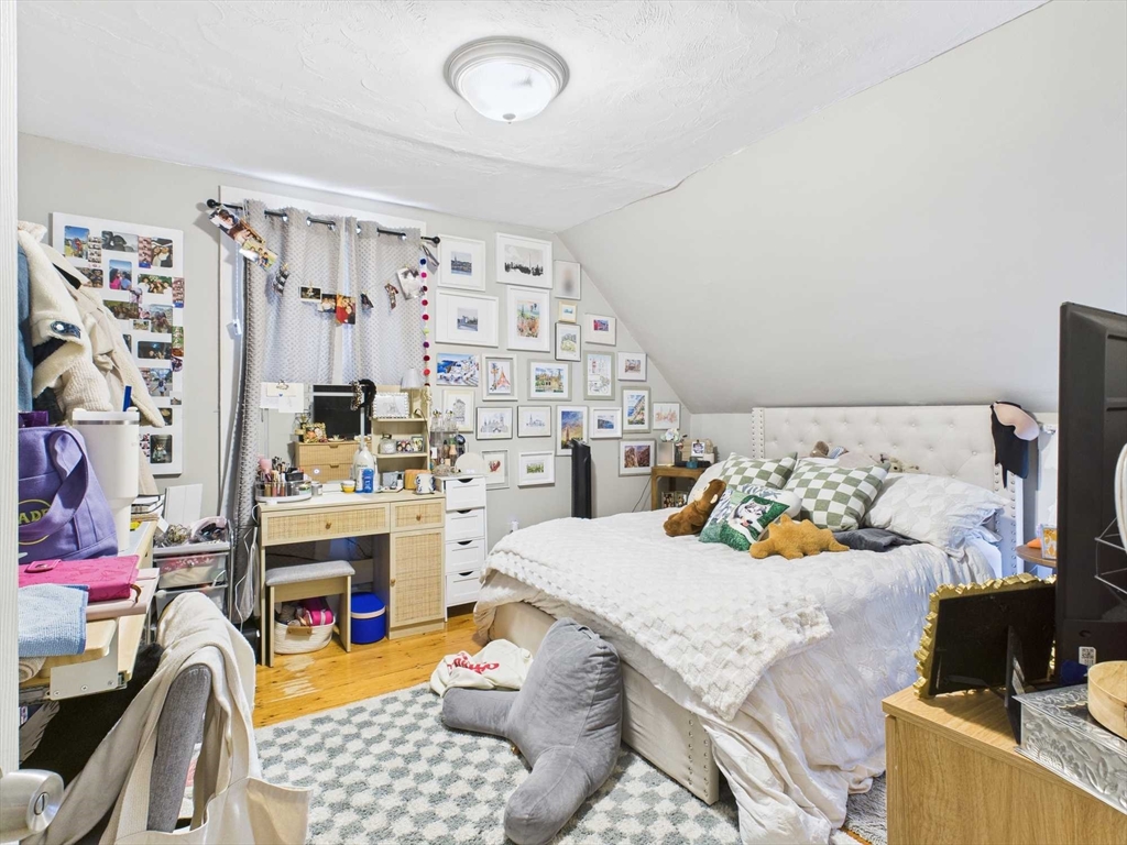 16-22 Reedsdale Street Boston, MA 02134 - Photo 29 of 39 a bedroom with furniture and a bed