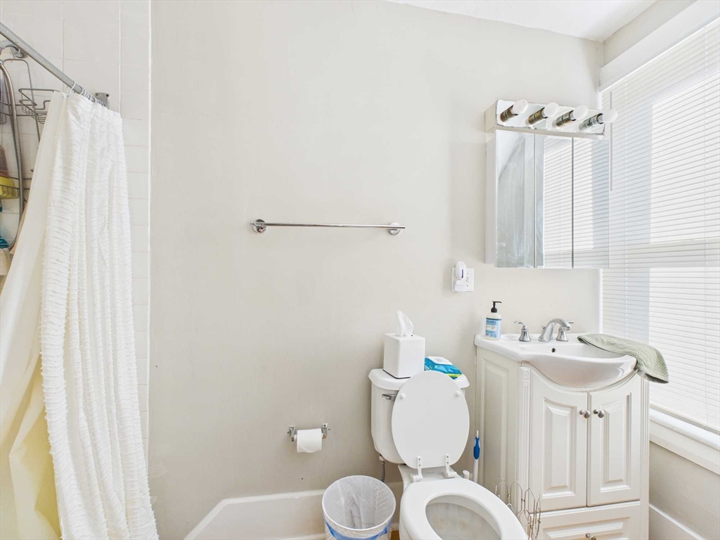 16-22 Reedsdale Street Boston, MA 02134 - Photo 31 of 39 a bathroom with a sink toilet and shower