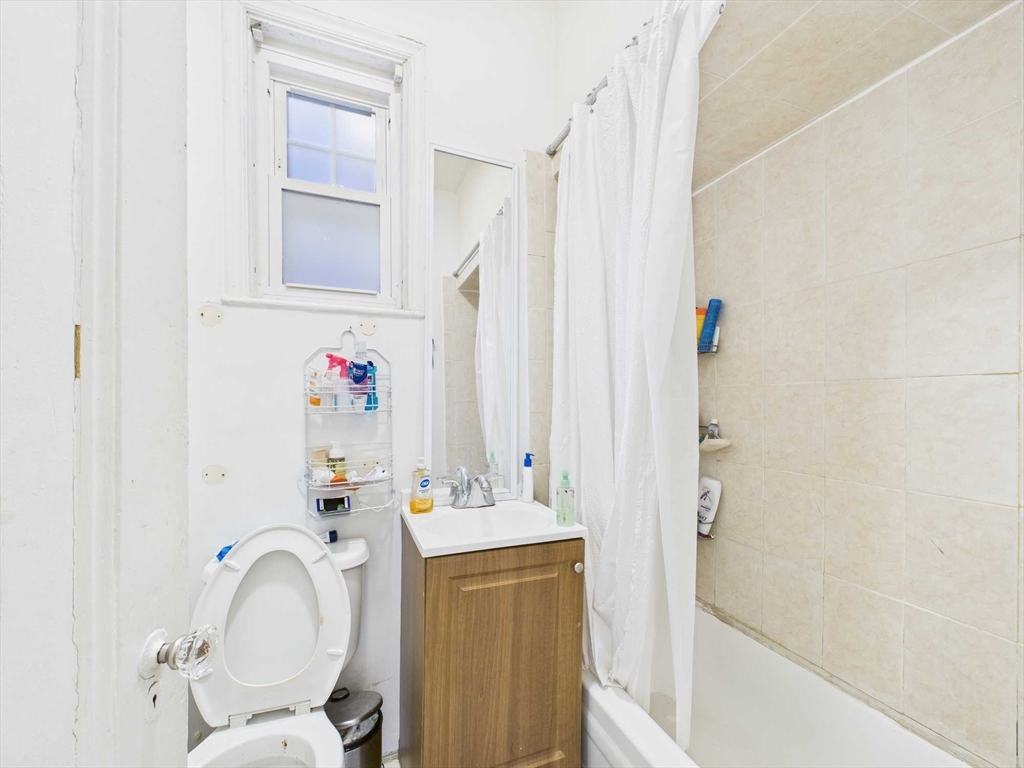 16-22 Reedsdale Street Boston, MA 02134 - Photo 35 of 39 a bathroom with a sink toilet and shower