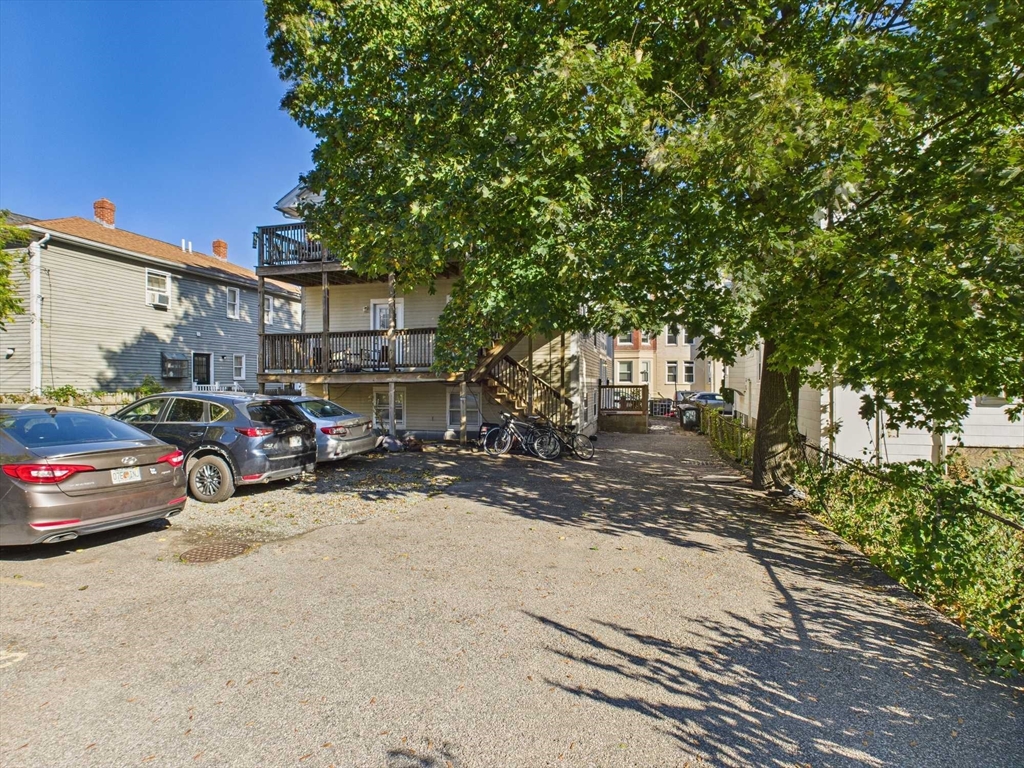 16-22 Reedsdale Street Boston, MA 02134 - Photo 4 of 39 a view of a cars parked in front of a house