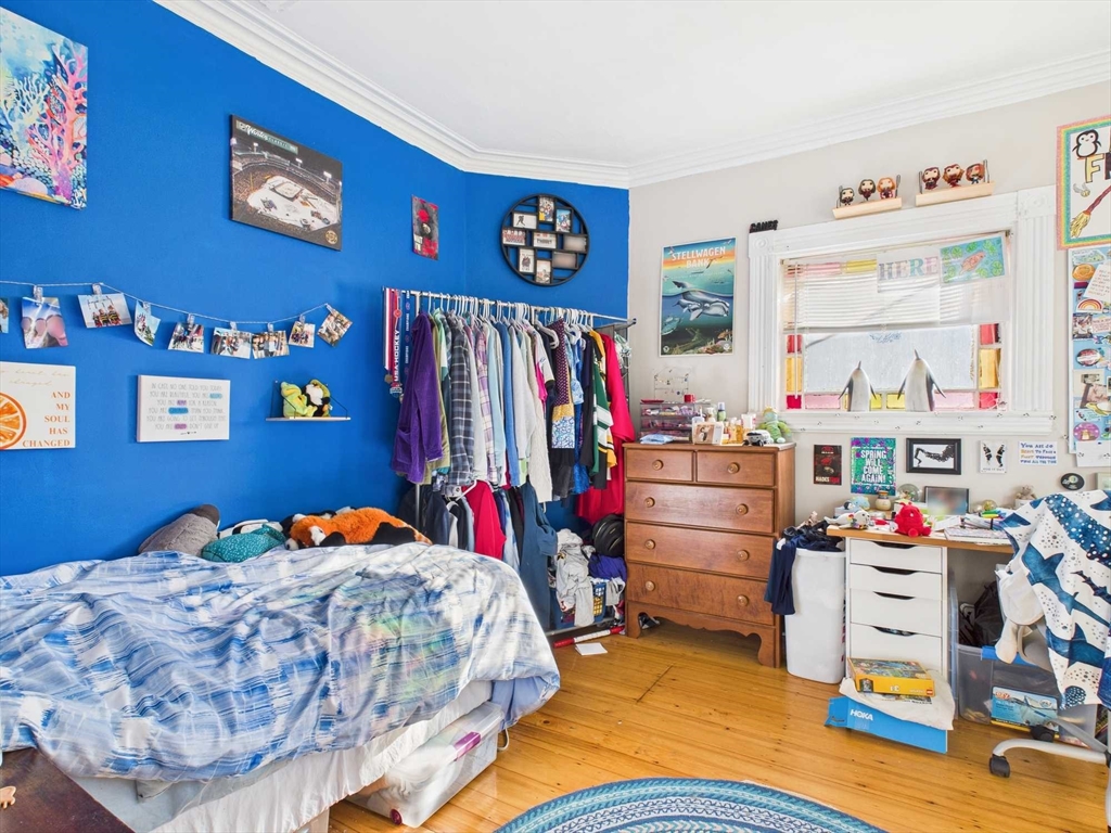 16-22 Reedsdale Street Boston, MA 02134 - Photo 5 of 39 a bedroom with bed and a window