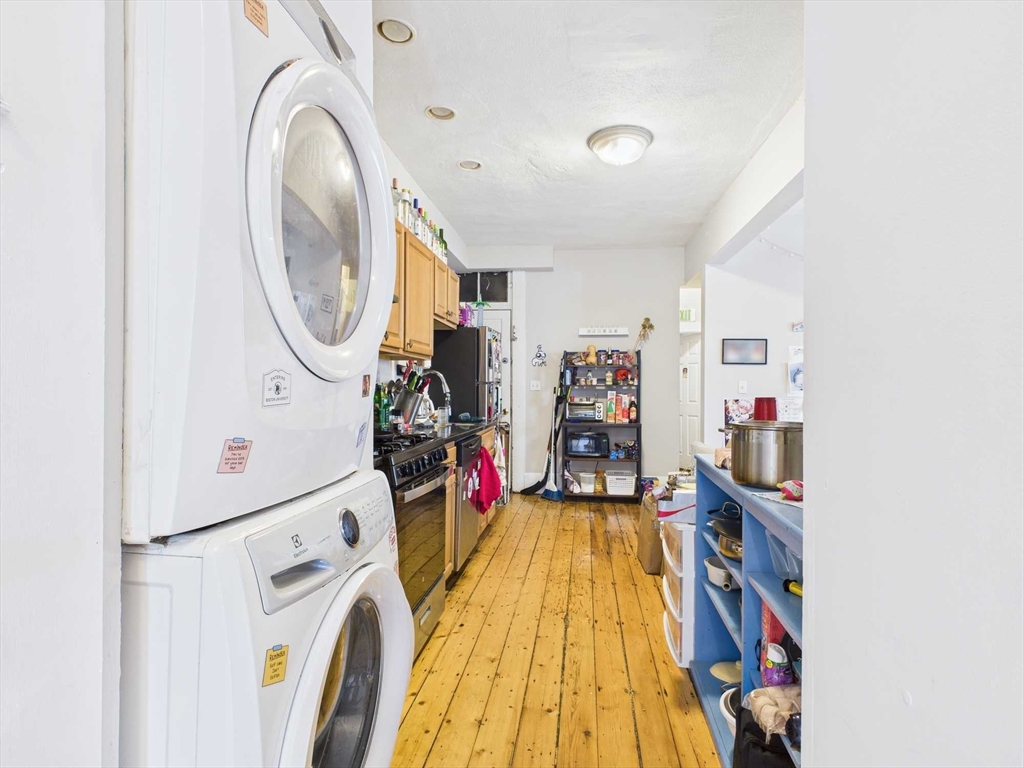 16-22 Reedsdale Street Boston, MA 02134 - Photo 6 of 39 a view of a storage & utility room with washer and dryer
