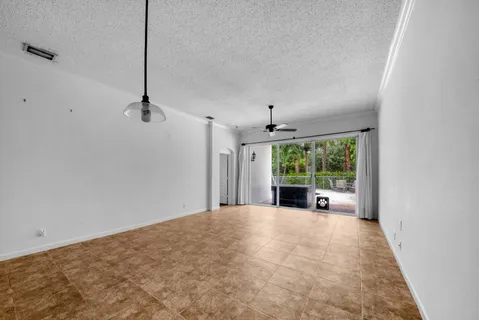 a view of an empty room with a balcony
