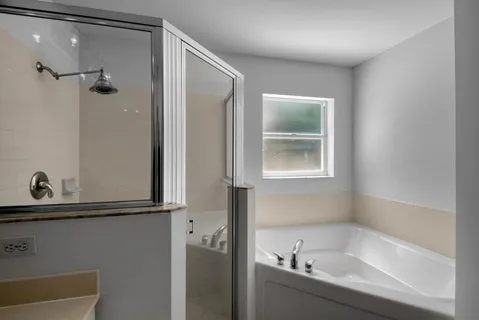 a bathroom with a double vanity sink mirror and double