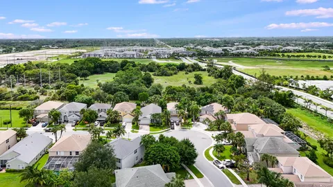 an aerial view of residential house with outdoor space and swimming pool
