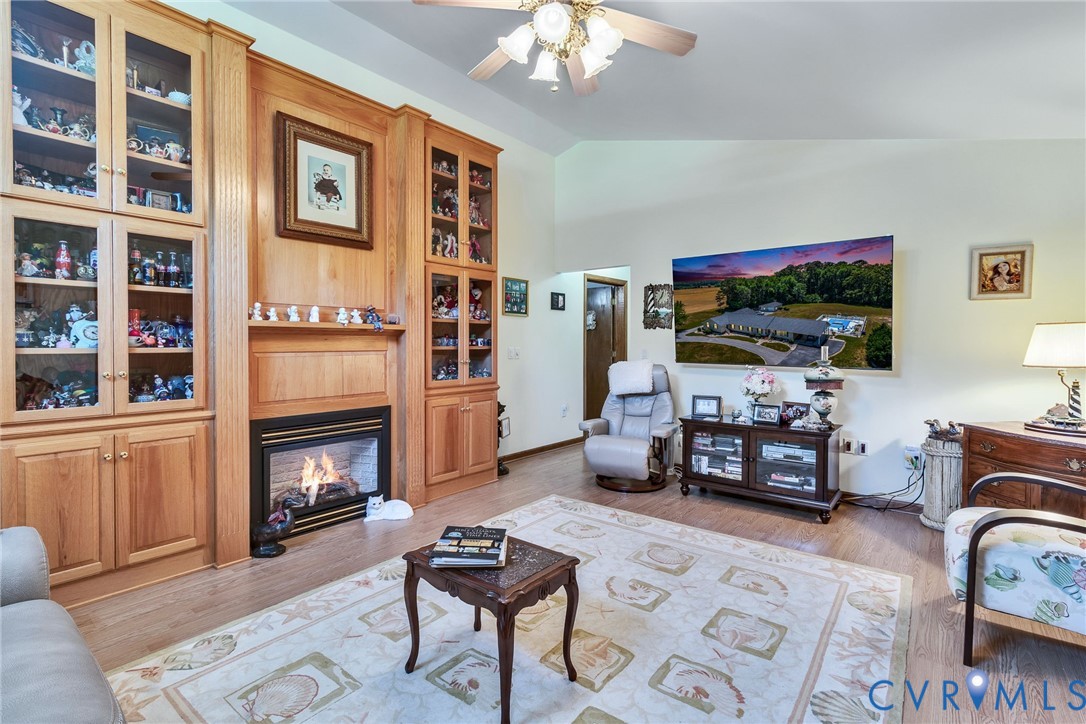 4400 Hacks Neck Road Heathsville, VA 22473 - Photo 32 of 78 a living room with furniture a flat screen tv and a fireplace