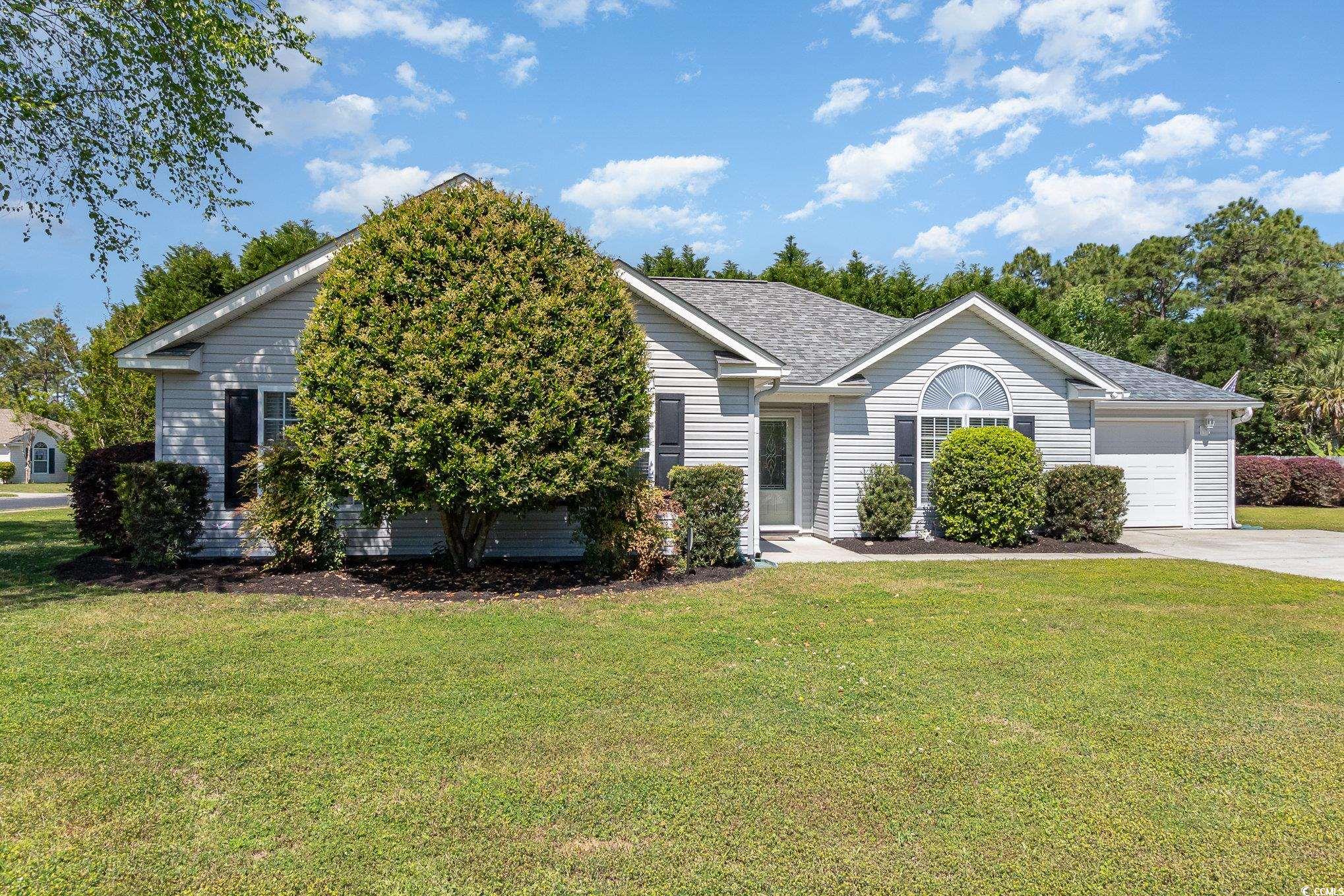 Single story home featuring an attached garage, a
