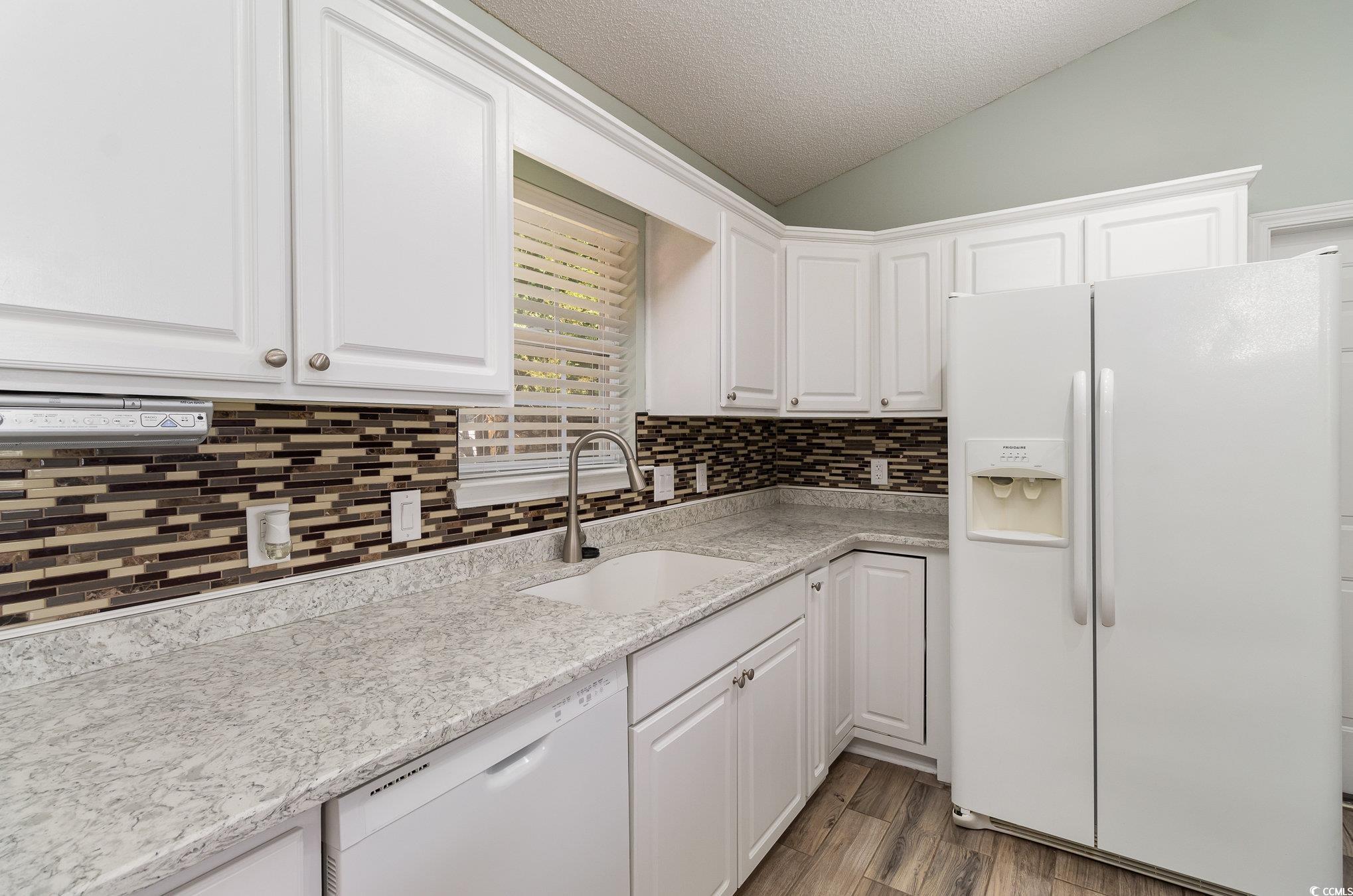 2654 Wild Game Trail Myrtle Beach, SC 29588 - Photo 11 of 37 Kitchen featuring tasteful backsplash, a sink, whi