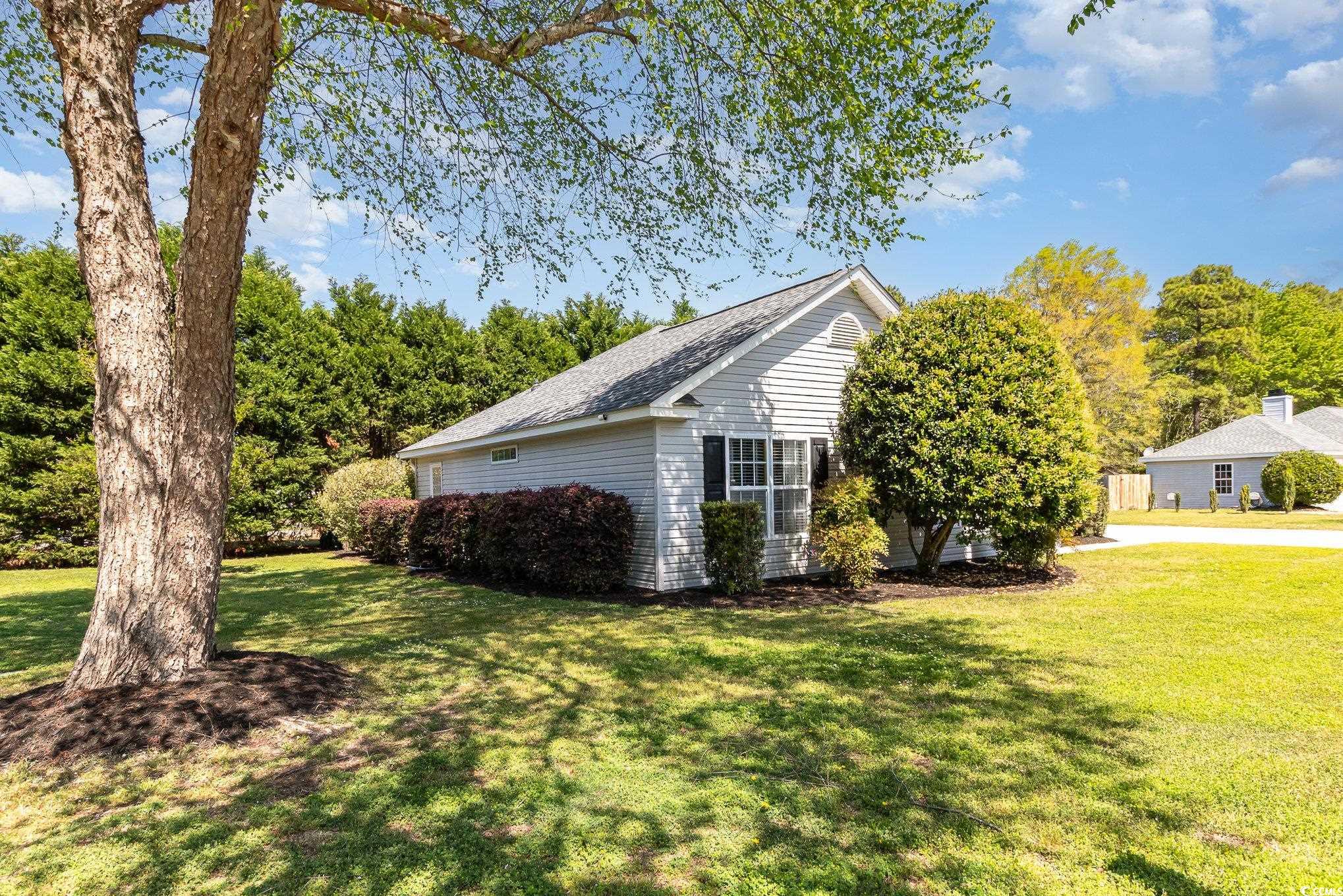 2654 Wild Game Trail Myrtle Beach, SC 29588 - Photo 2 of 37 View of side of property with a lawn