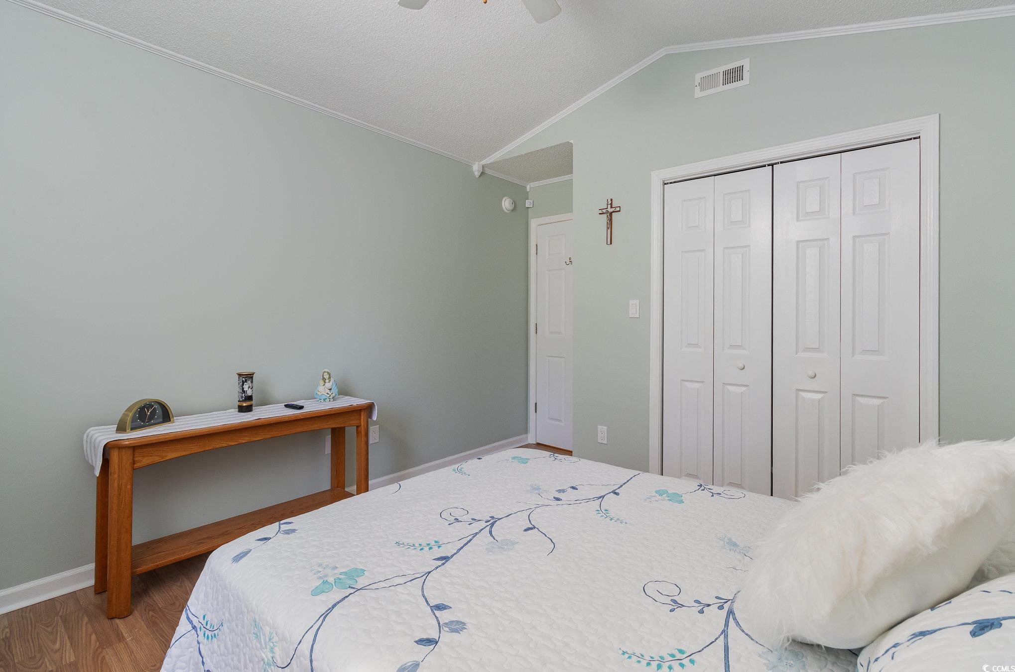 2654 Wild Game Trail Myrtle Beach, SC 29588 - Photo 22 of 37 Bedroom featuring a closet, ornamental molding, vi