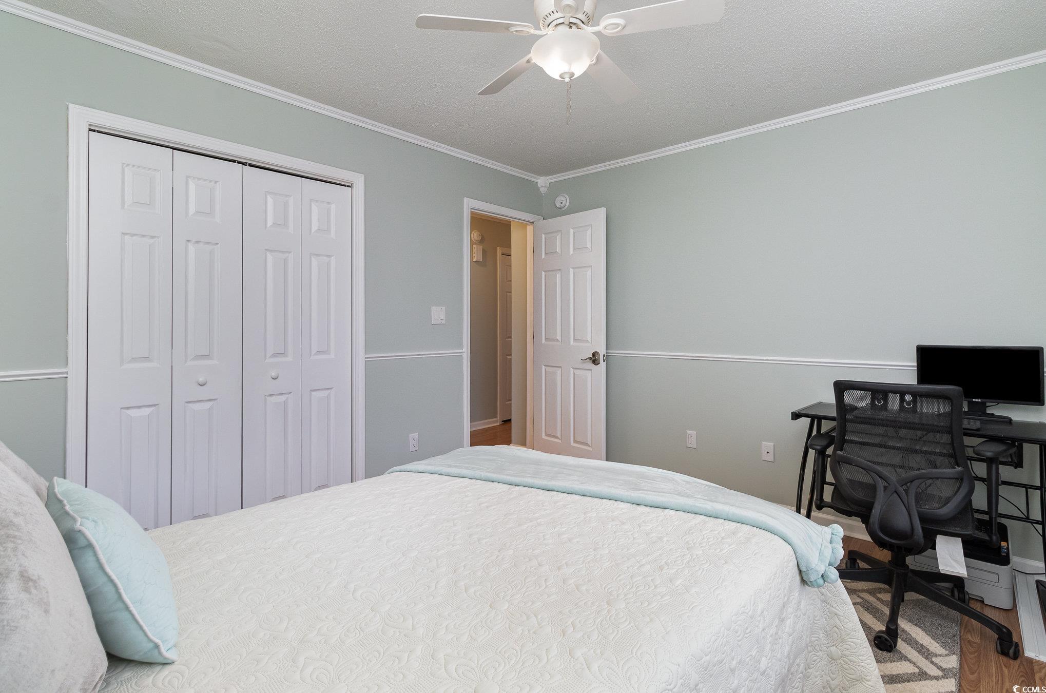 2654 Wild Game Trail Myrtle Beach, SC 29588 - Photo 24 of 37 Bedroom featuring a closet, crown molding, a ceili