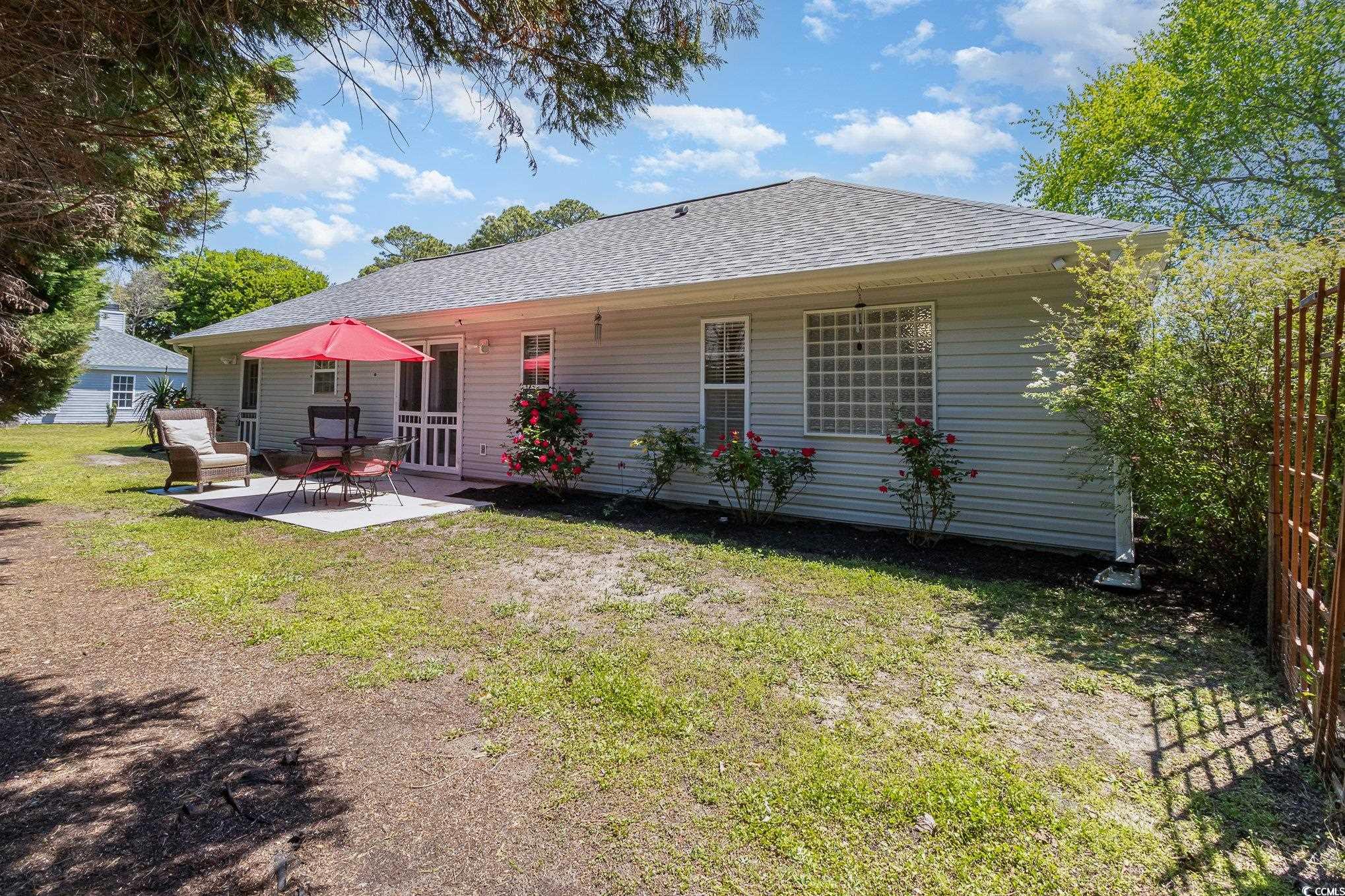 2654 Wild Game Trail Myrtle Beach, SC 29588 - Photo 28 of 37 Back of property with roof with shingles, a patio,