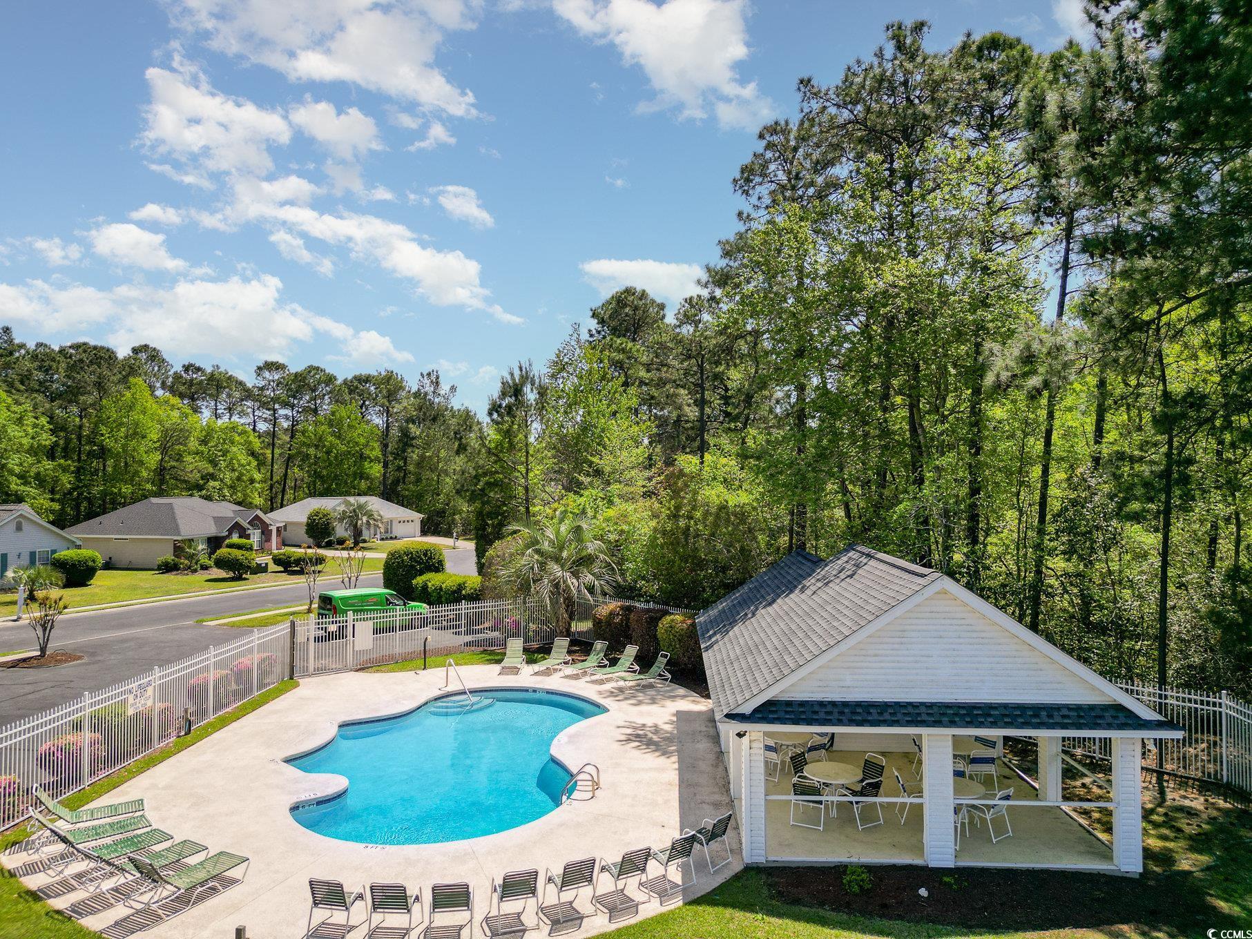 2654 Wild Game Trail Myrtle Beach, SC 29588 - Photo 34 of 37 Pool with a patio area, fence, and a lawn