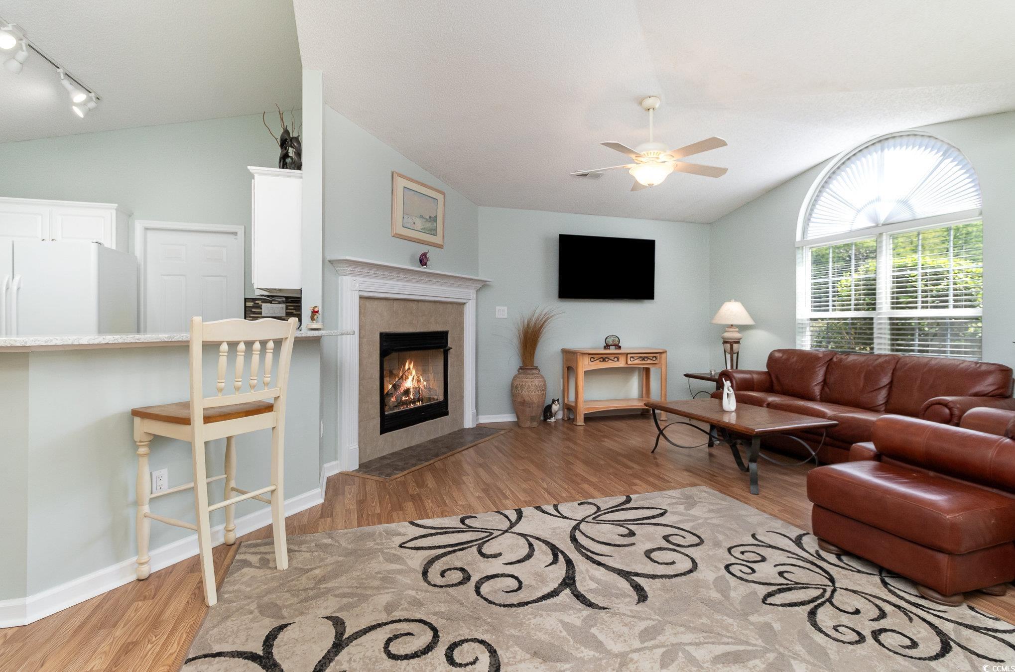 2654 Wild Game Trail Myrtle Beach, SC 29588 - Photo 5 of 37 Living room with lofted ceiling, track lighting, c