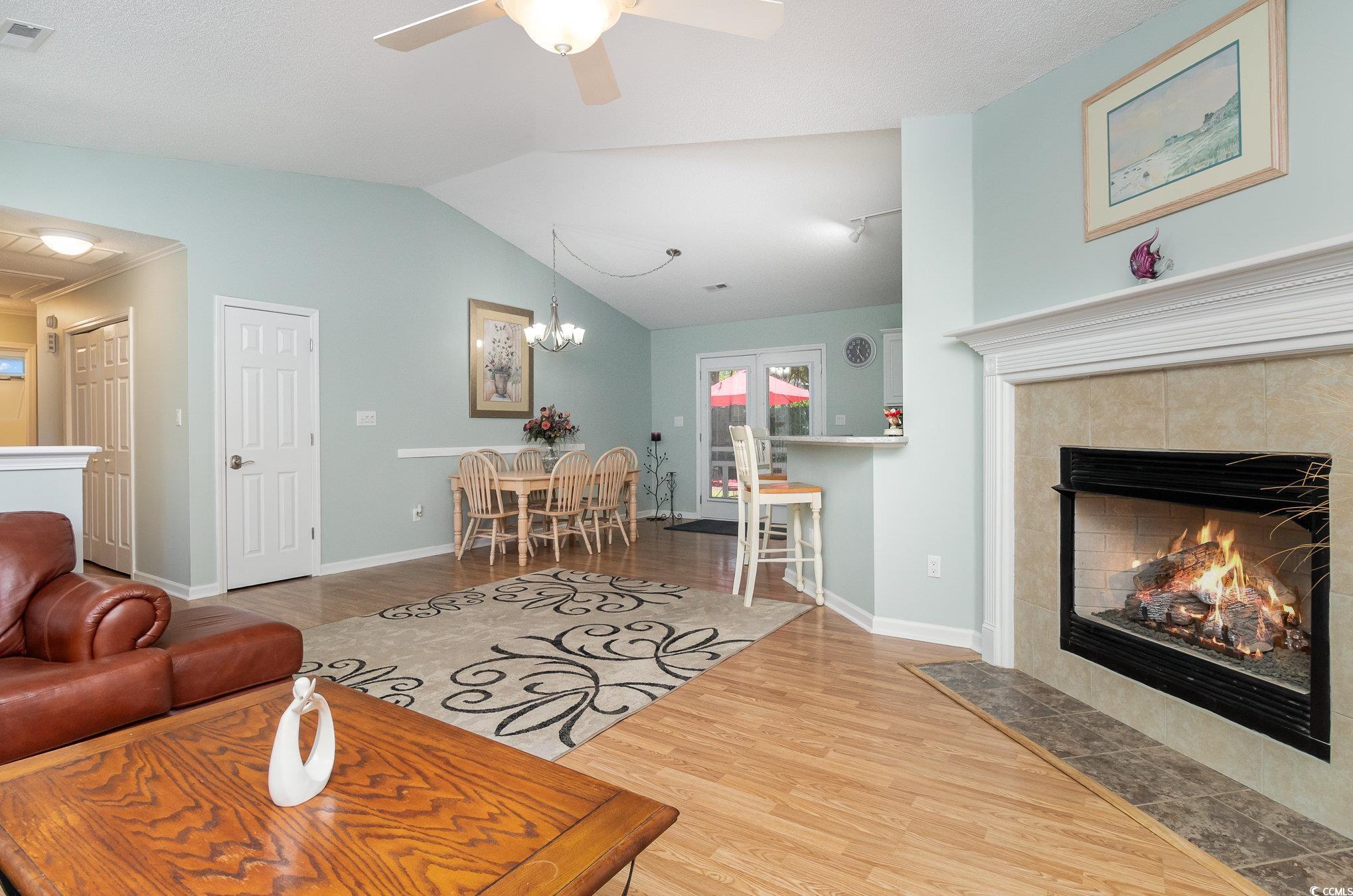 2654 Wild Game Trail Myrtle Beach, SC 29588 - Photo 7 of 37 Living area with visible vents, wood finished floo