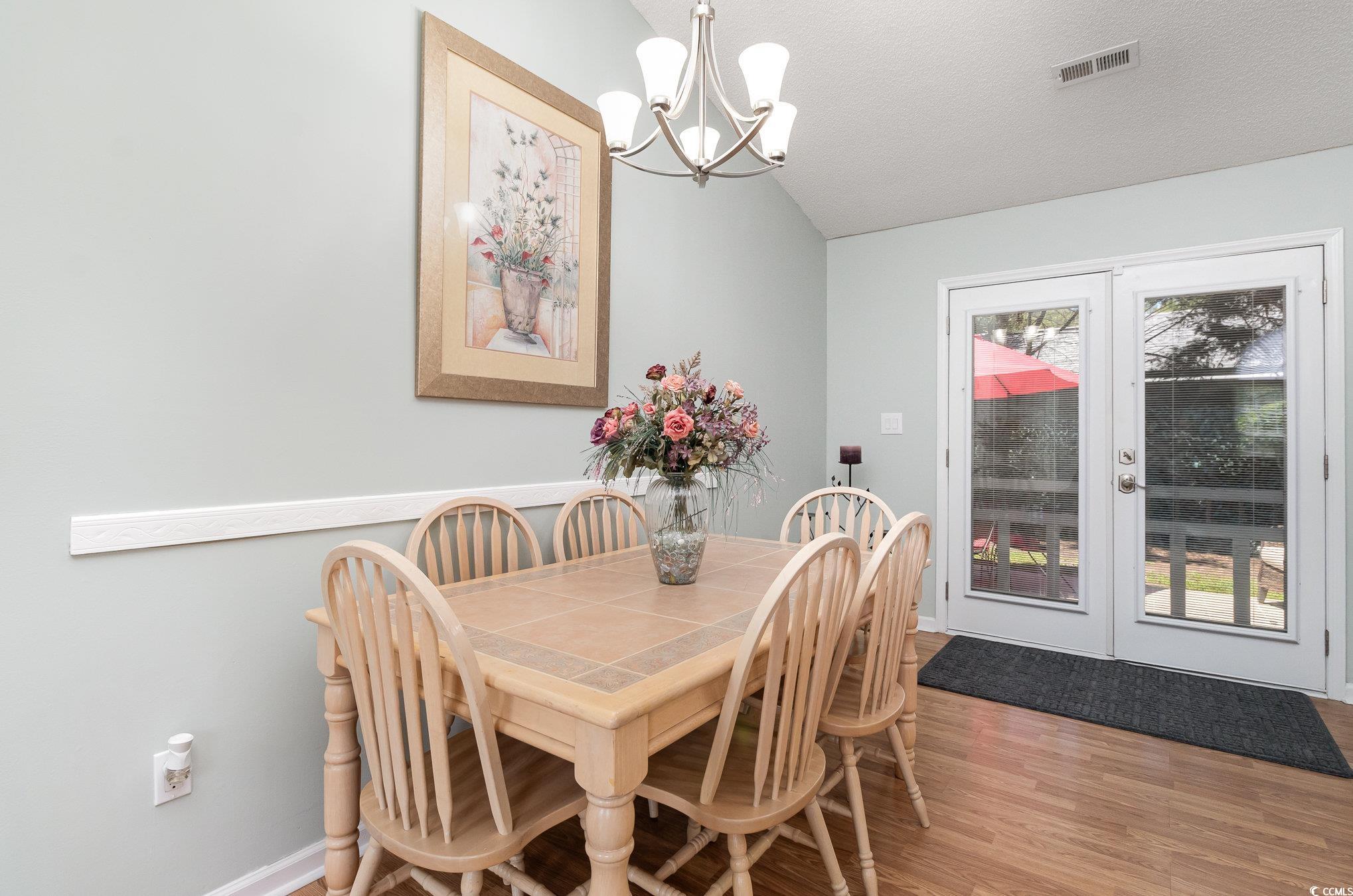 2654 Wild Game Trail Myrtle Beach, SC 29588 - Photo 9 of 37 Dining room featuring vaulted ceiling, an inviting