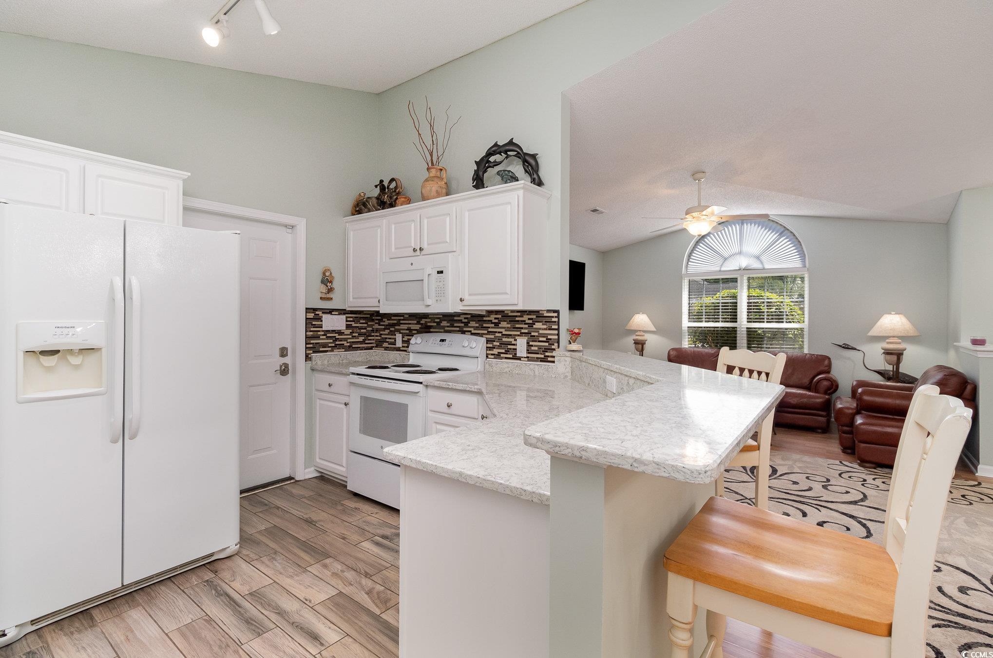 2654 Wild Game Trail Myrtle Beach, SC 29588 - Photo 37 of 37 Kitchen with white appliances, open floor plan, a