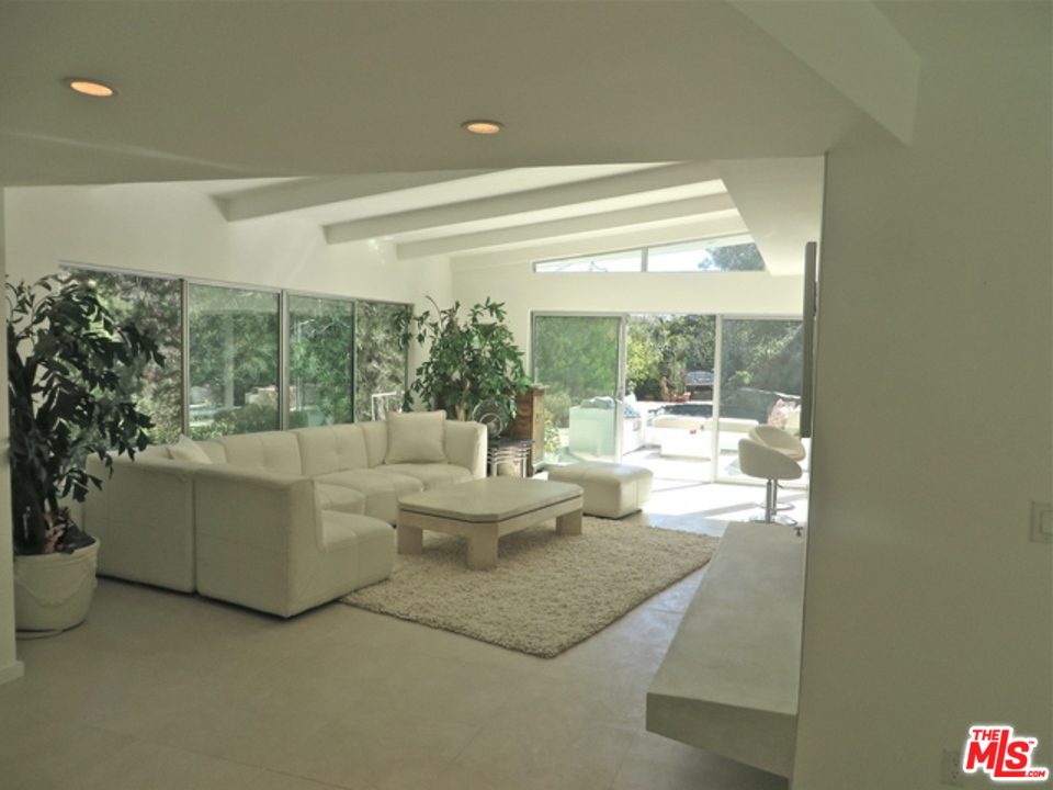 9659 Cedarbrook Drive Beverly Hills, CA 90210 - Photo 2 of 21 a living room with furniture and a large window