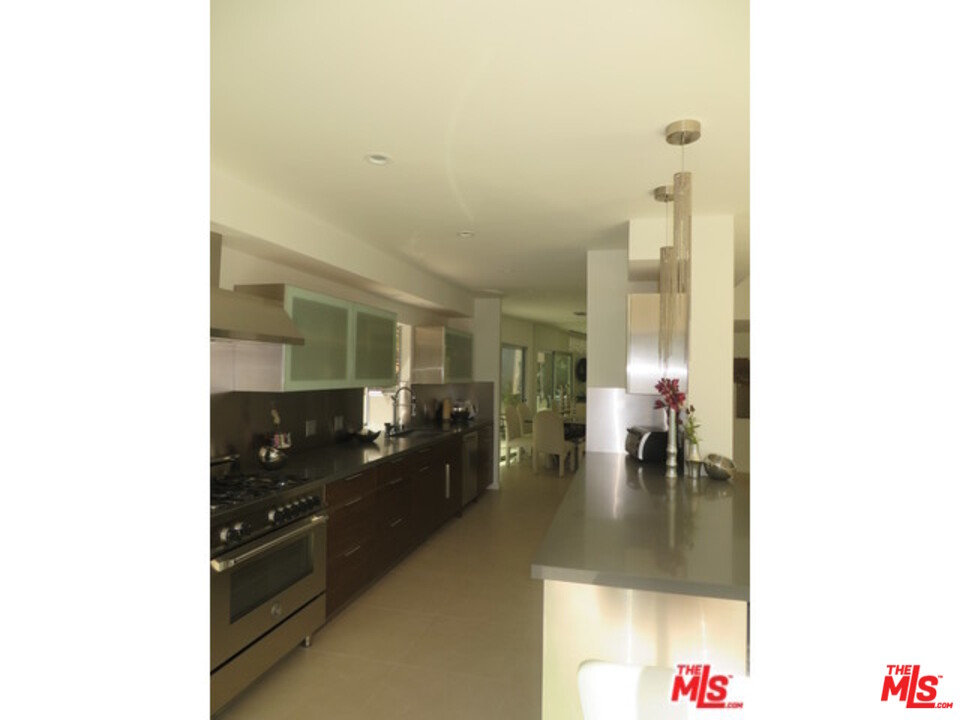 9659 Cedarbrook Drive Beverly Hills, CA 90210 - Photo 9 of 21 a hallway with a view of living room with furniture