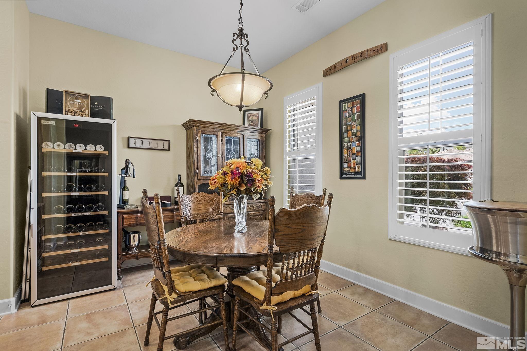 1465 Meridian Ranch Drive Reno, NV 89523 - Photo 13 of 40 a view of a dining room with furniture and window