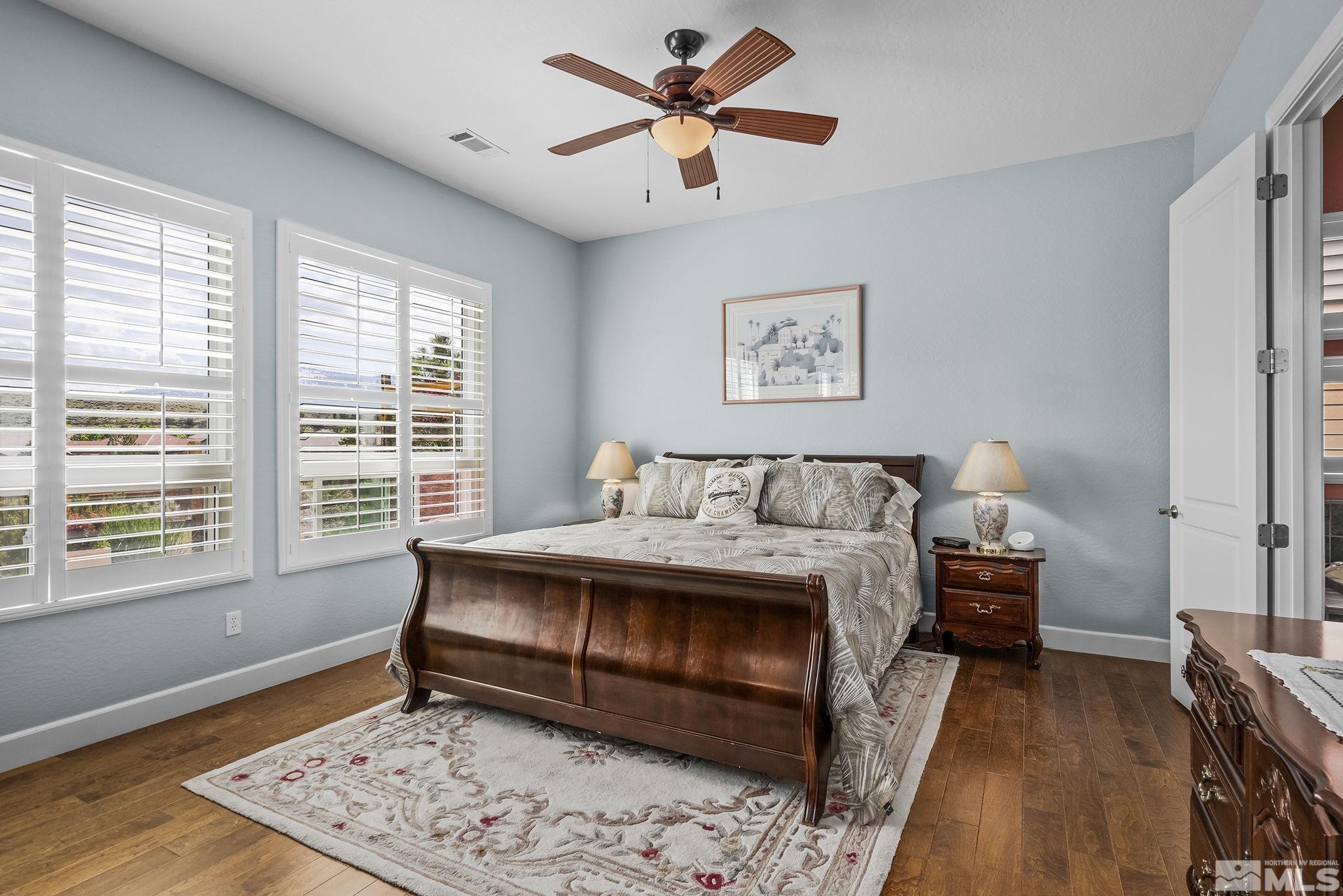 1465 Meridian Ranch Drive Reno, NV 89523 - Photo 14 of 40 a spacious bedroom with a bed and a window