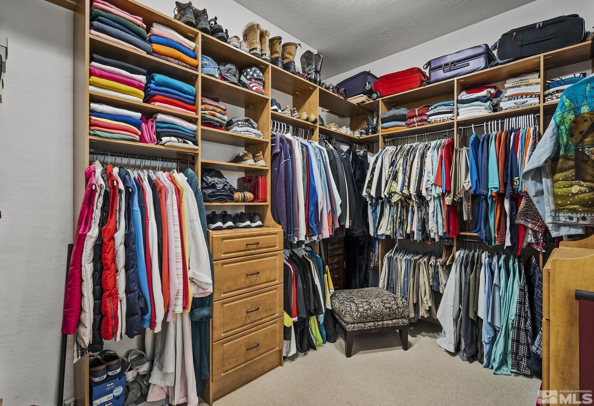 1465 Meridian Ranch Drive Reno, NV 89523 - Photo 19 of 40 a view of walk in closet with clothes and shoes