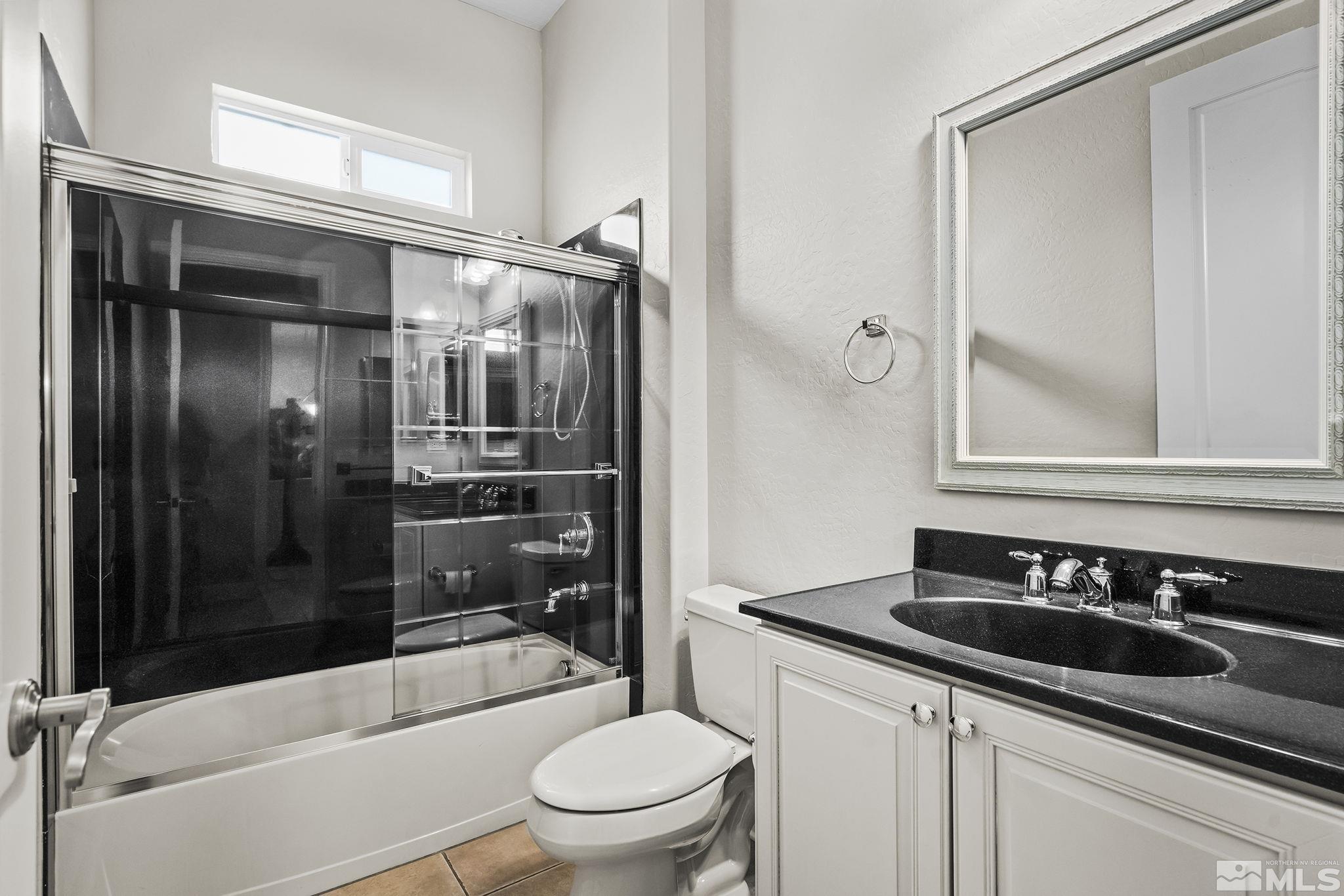 1465 Meridian Ranch Drive Reno, NV 89523 - Photo 21 of 40 a bathroom with a sink a toilet and shower