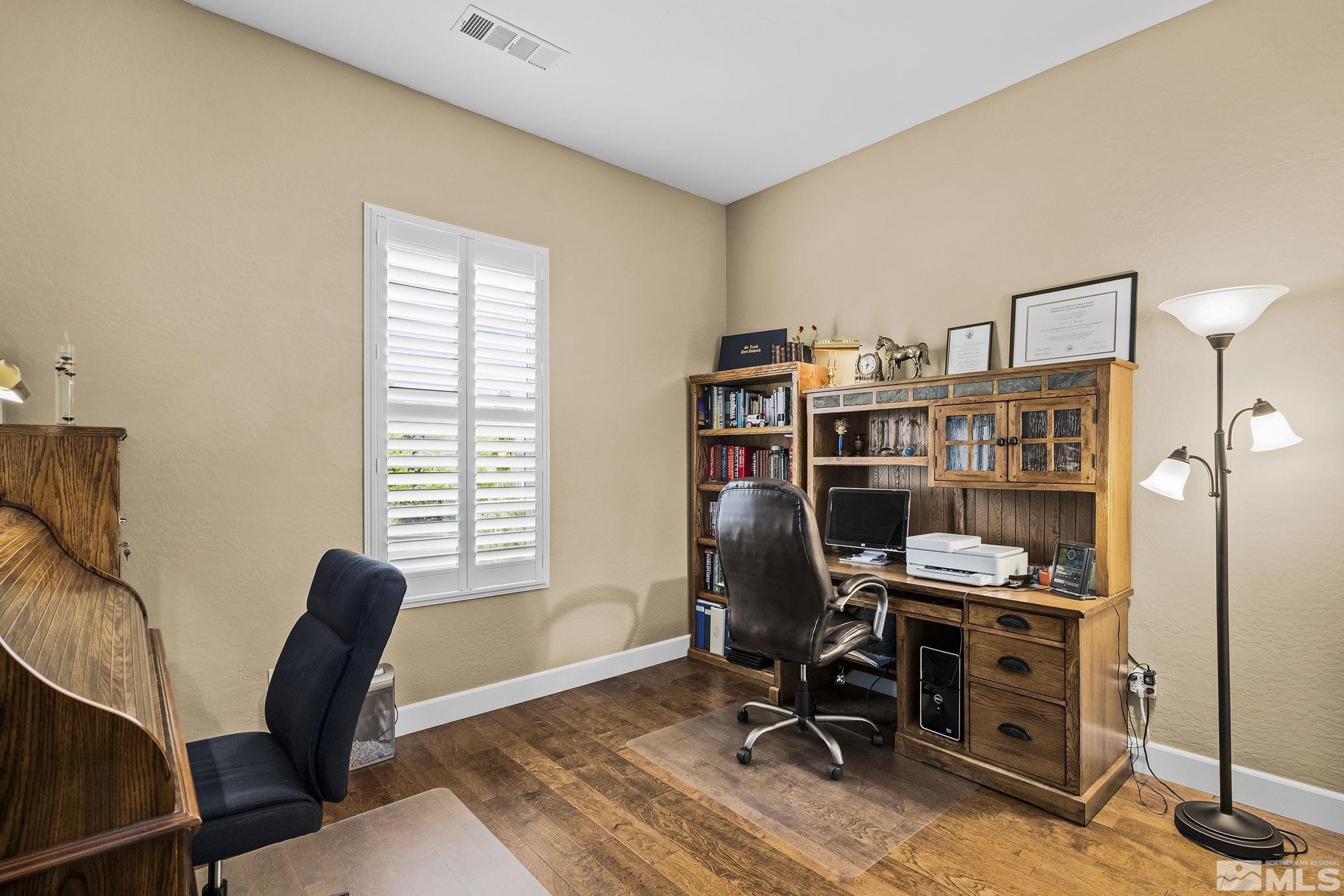 1465 Meridian Ranch Drive Reno, NV 89523 - Photo 22 of 40 a view of a workspace with furniture and a window