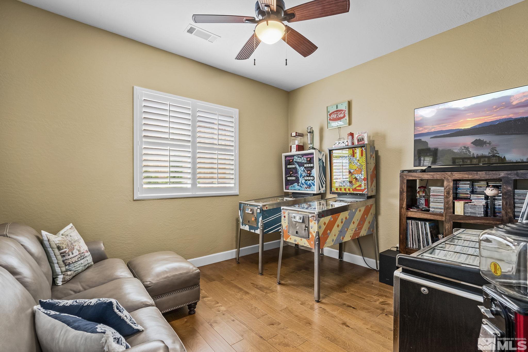 1465 Meridian Ranch Drive Reno, NV 89523 - Photo 23 of 40 a work room with furniture and a flat screen tv