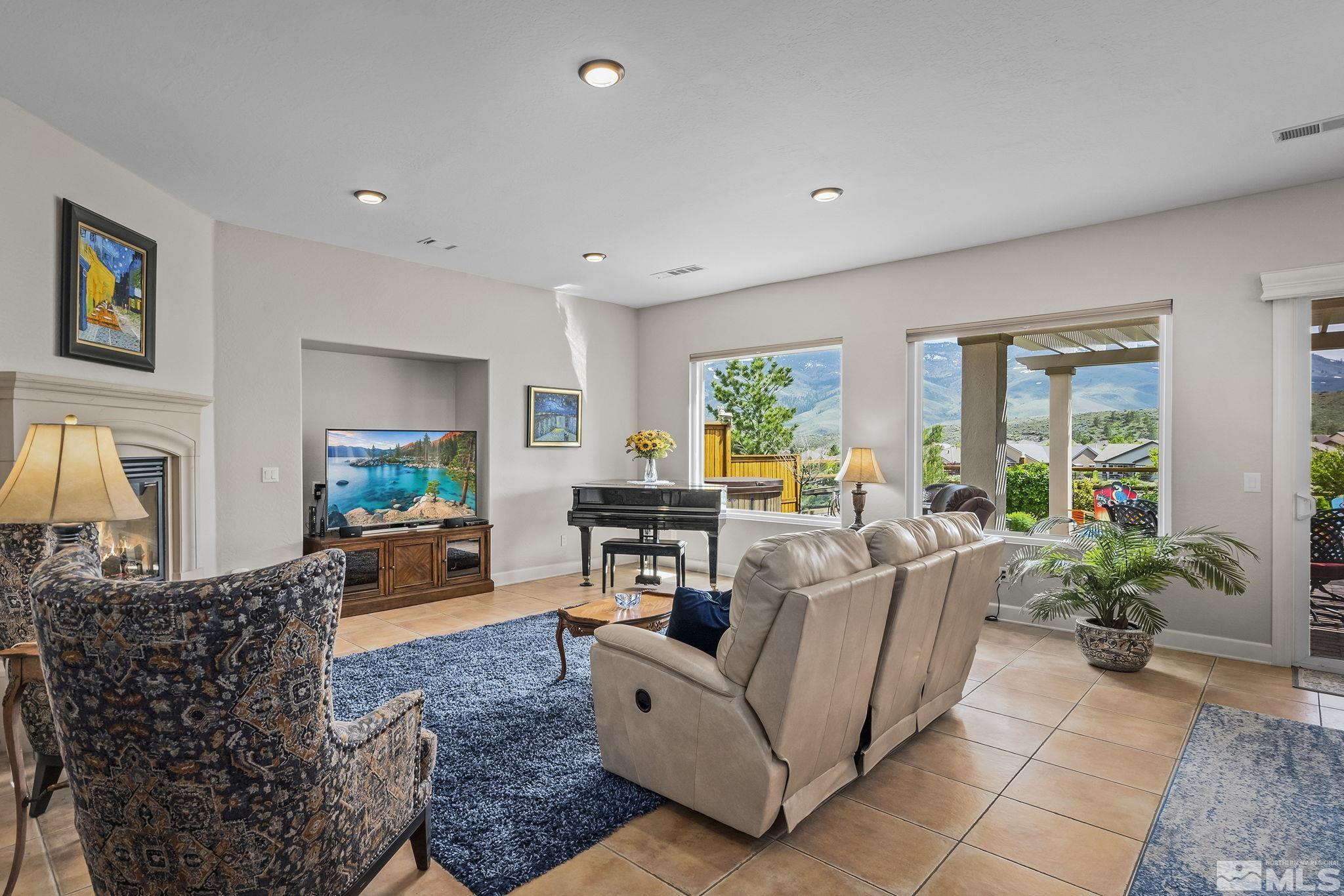 1465 Meridian Ranch Drive Reno, NV 89523 - Photo 4 of 40 a living room with furniture and a potted plant