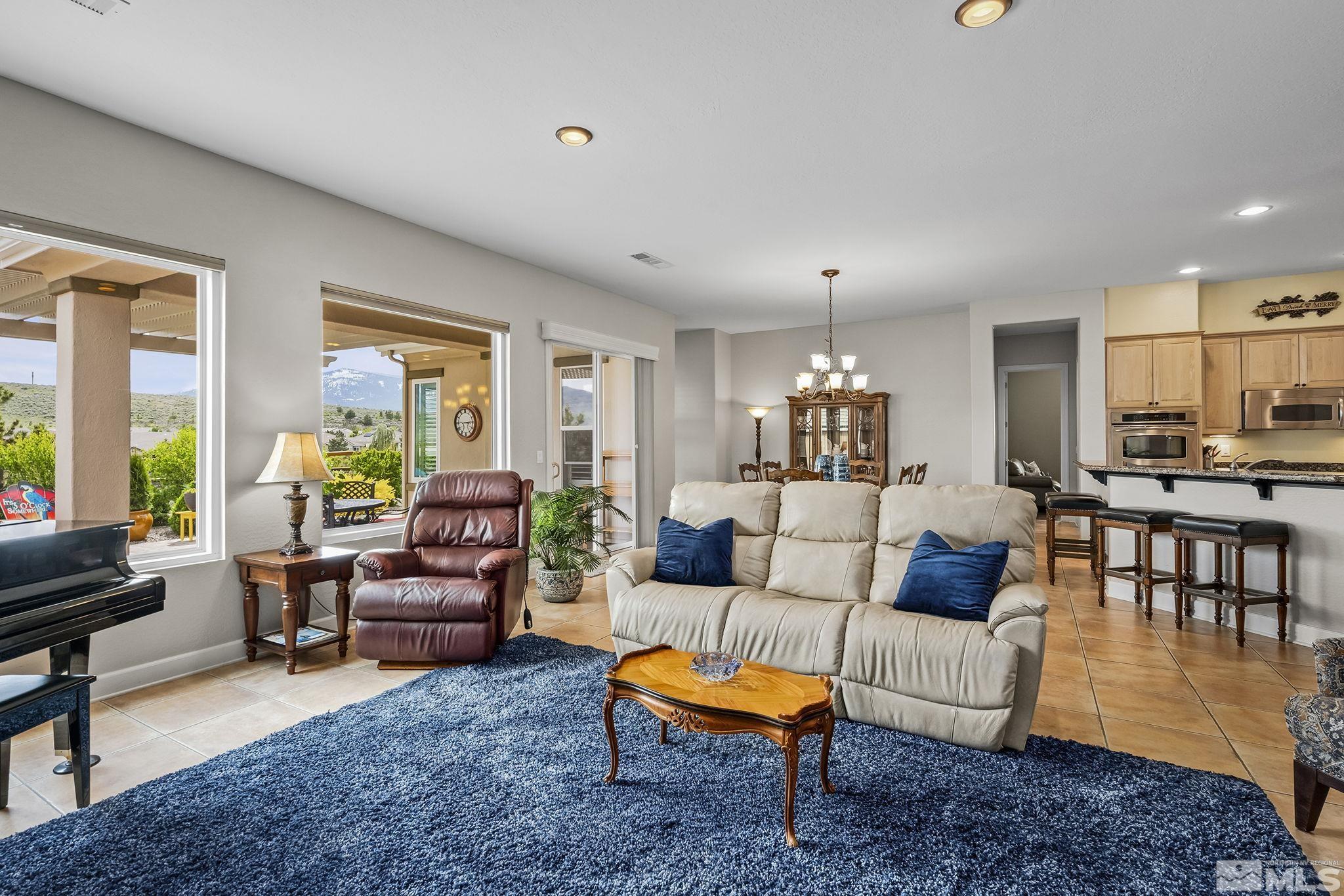 1465 Meridian Ranch Drive Reno, NV 89523 - Photo 7 of 40 a living room with furniture and a dining table