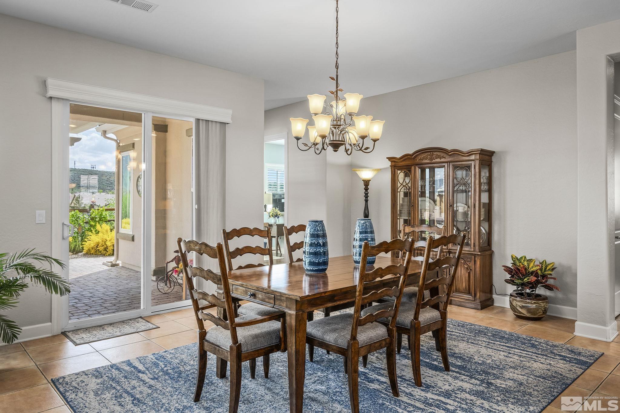 1465 Meridian Ranch Drive Reno, NV 89523 - Photo 8 of 40 a view of a dining room with furniture window and wooden floor