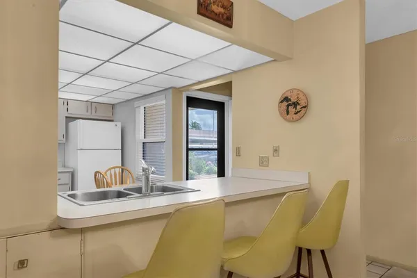 a kitchen with stainless steel appliances granite countertop a sink a stove and cabinets