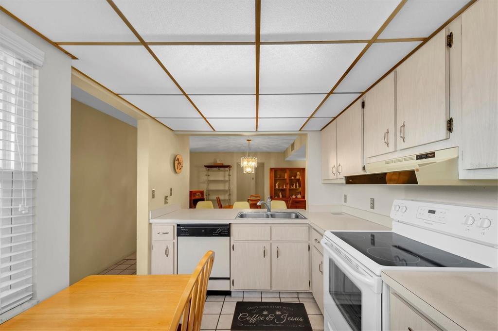 12300 Vonn Road, Unit 4101 Largo, FL 33774 - Photo 15 of 46 a kitchen that has a lot of cabinets in it and appliances