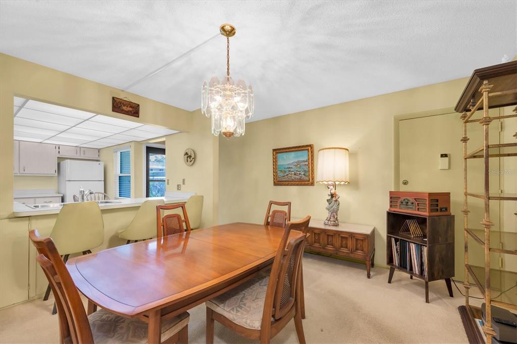 12300 Vonn Road, Unit 4101 Largo, FL 33774 - Photo 16 of 46 a view of a dining room with furniture