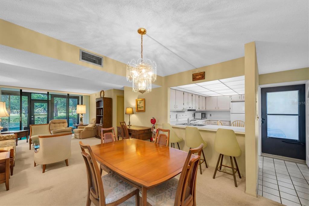 12300 Vonn Road, Unit 4101 Largo, FL 33774 - Photo 17 of 46 a view of a dining room with furniture window and outside view